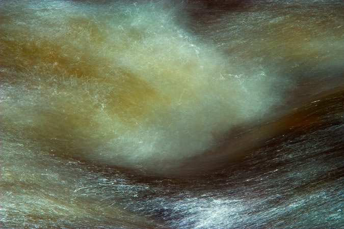 Tempest I - Interaction of water and sunlight on a rock in the river Bain, North Yorkshire, England
